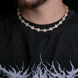 a close up of a man wearing a necklace