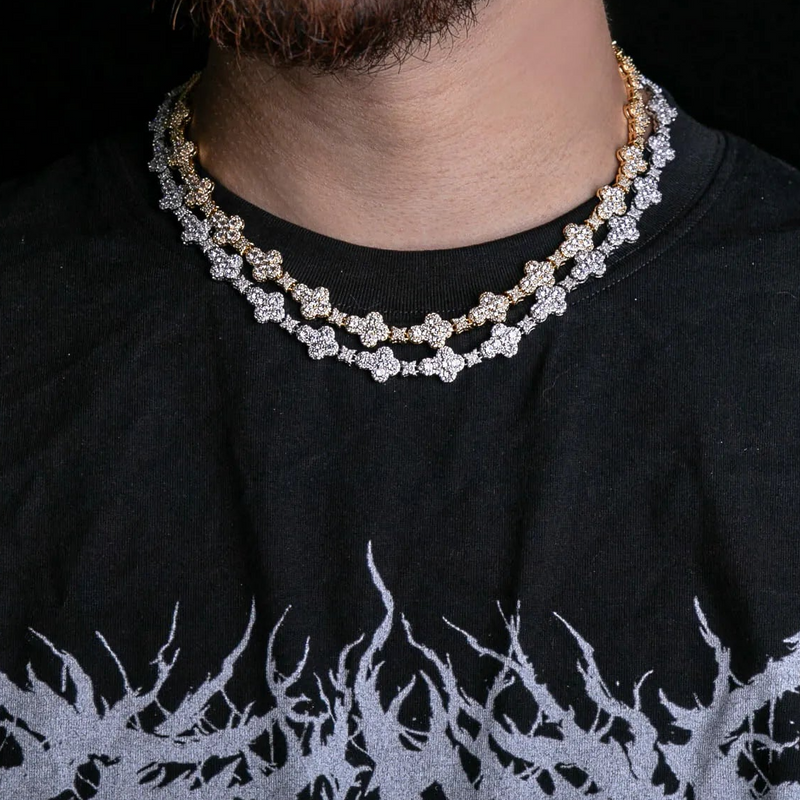 a close up of a man wearing a necklace