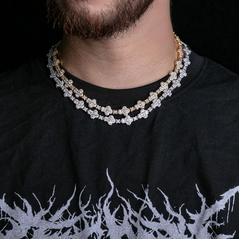 a close up of a man wearing a necklace