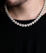 a close up of a man wearing a necklace