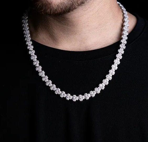 a man wearing a diamond necklace