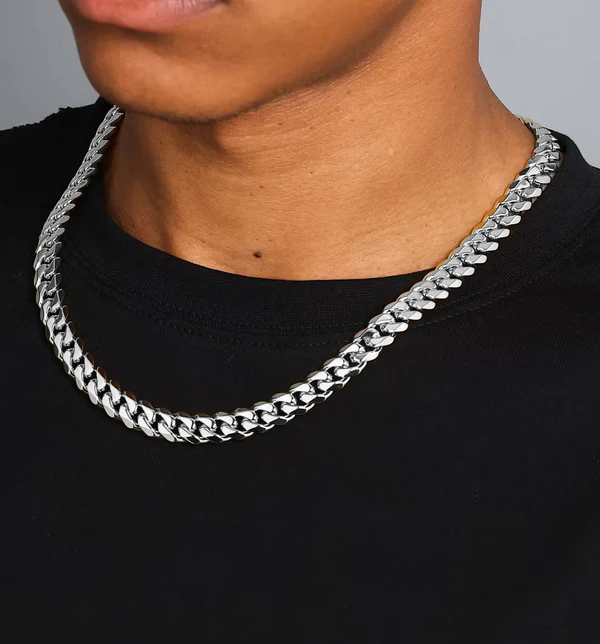 a man wearing a silver chain necklace